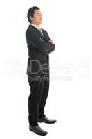 Side view Asian businessman arms folded