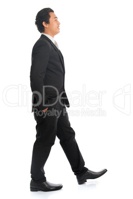 Side view Asian man walking