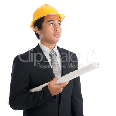 Asian man with safety helmet and blue prints