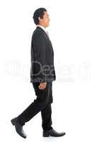 Side view Asian business man walking