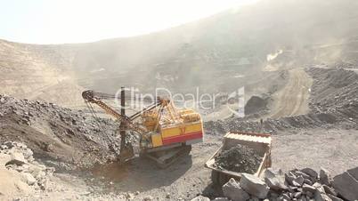 The excavator and dumper in the quarry