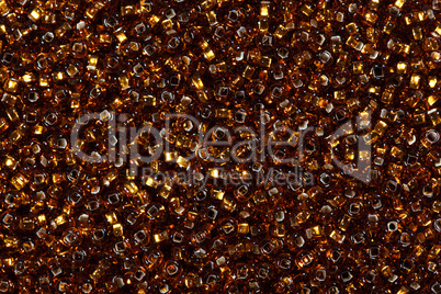 Multicolored golden seed beads.