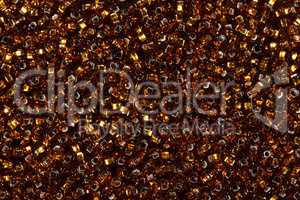 Multicolored golden seed beads.