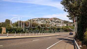 Blue sky over Pacific Coast Highway road heading into Laguna Bea