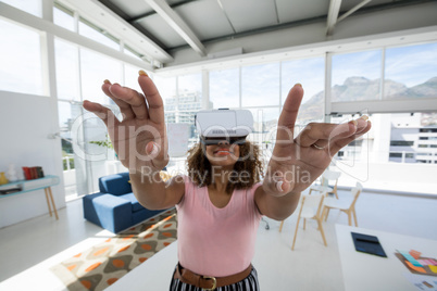 Female executive using virtual reality headset