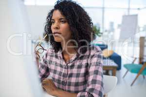 Female executive working on computer at desk