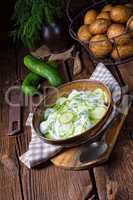 fresh cucumber salad with yogurt and young potatoes