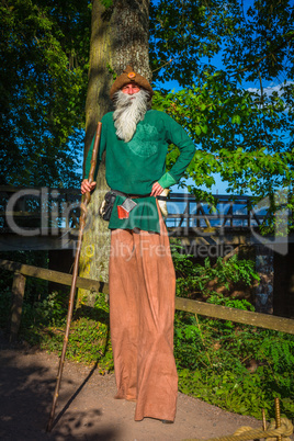 bearded man with walking stick