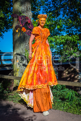 actor in orange dress