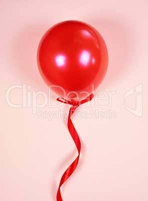 Red balloon on a red ribbon