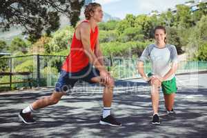 Friends exercising on road