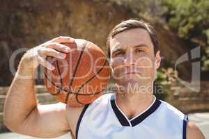 Confident basketball player with ball