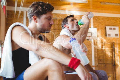 Friends drinking water in court