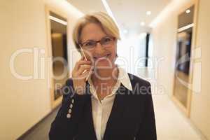 Smiling businesswoman talking on phone