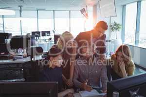 Business colleagues discussing together in office