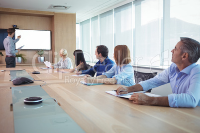 Business people at conference table during meeting