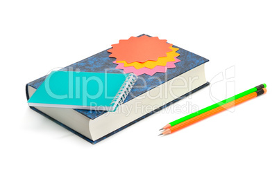 Book, pencils and notebook isolated on white background