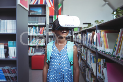 Girl wearing virtual reality simulator in library