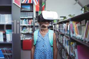 Girl wearing virtual reality simulator in library