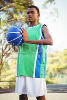 Portrait of teenage boy with basketbal