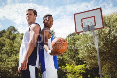 Basketball players standing back to back