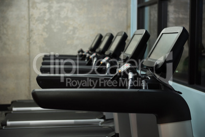 Treadmills in row at empty gym