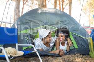 Happy couple talking in tent