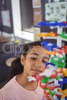 Elementary student looking at model in classroom