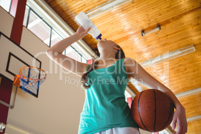Low angle view of woman drinking water
