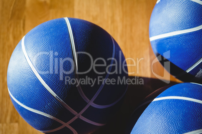 Close up of blue basketballs in court