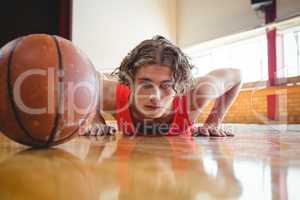 Portrait of male basketball player exercising