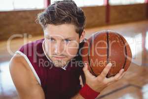 Close up of basketball player holding ball