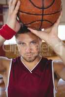 Close up portrait of male basketball player with ball