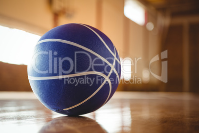 Blue basketball on hardwood floor