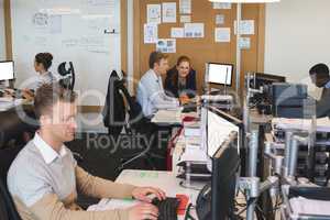 Business people working on computers at office