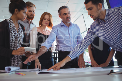 Creative business team discussing at desk
