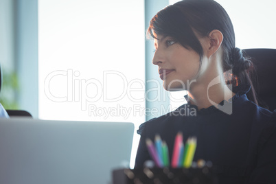 Young thoughtful woman looking away