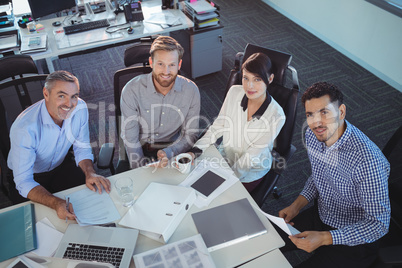 High angle portrait of business people discussing in meeting