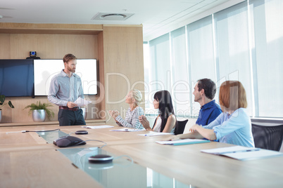 Business people discussing at conference table during meeting