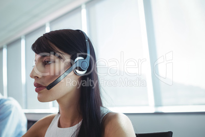 Close up of businesswoman using headset