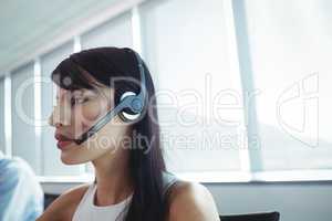Close up of businesswoman using headset