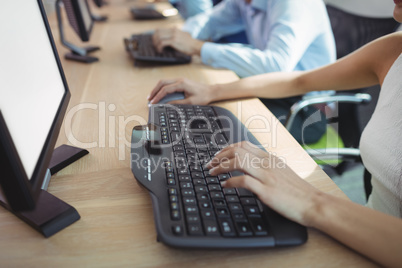 High angle view of businesswoman working on computer at call center