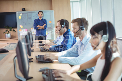 Manager with business team working at call center