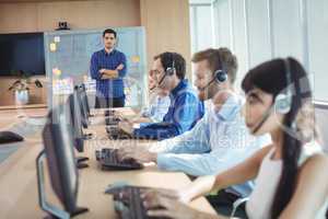 Manager with business team working at call center