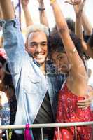 Portrait of young friends enjoying during music festival