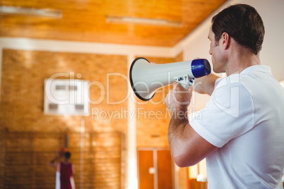 Male coach using megaphone