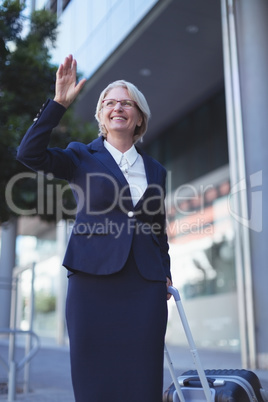 Smiling businesswoman gesturing