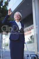 Smiling businesswoman gesturing