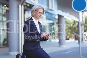 Businesswoman using phone