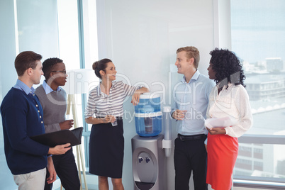 Young coworkers discussing at office